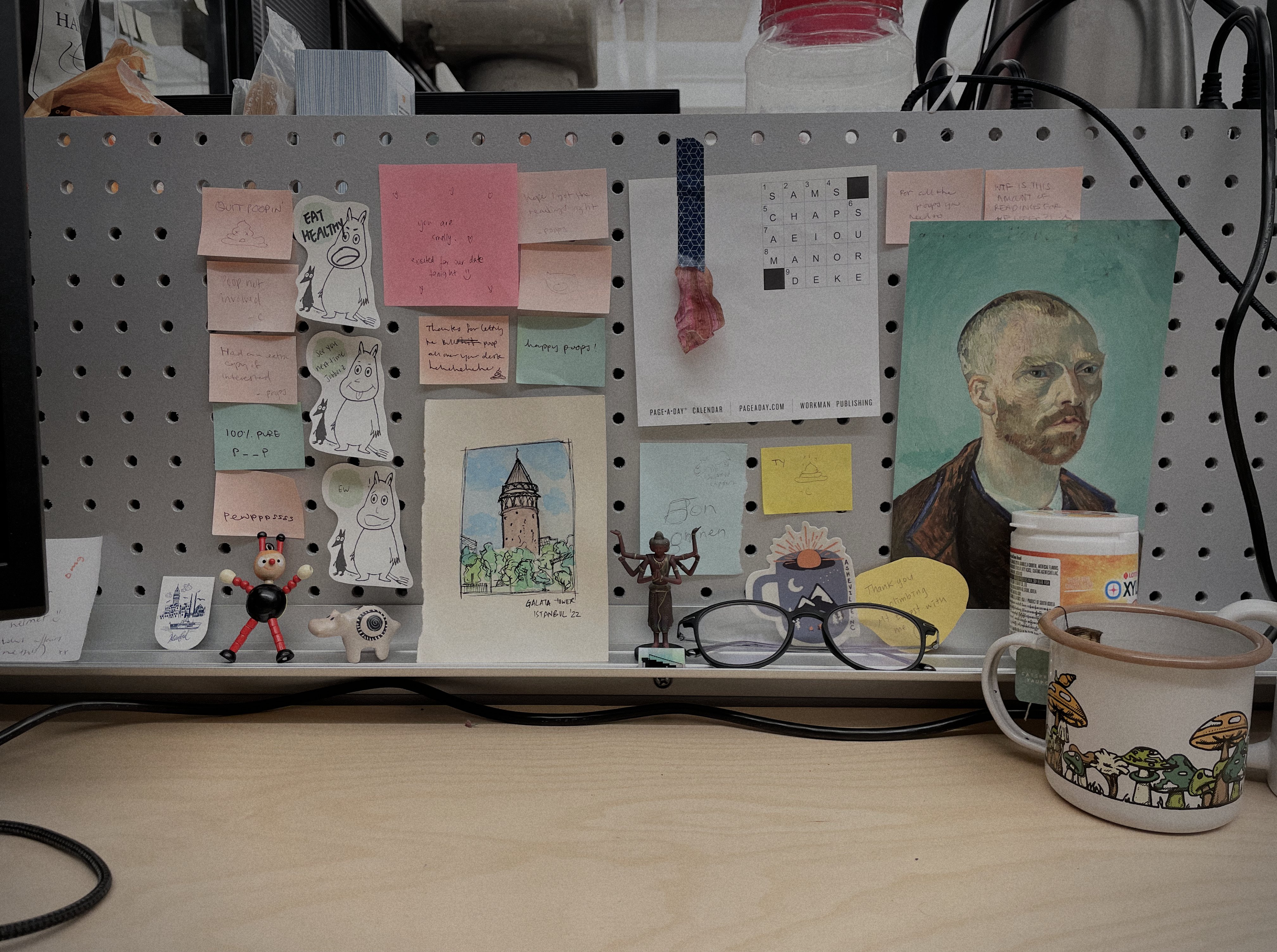 cubicle work space adorned with trinkets and messages of love from friends.