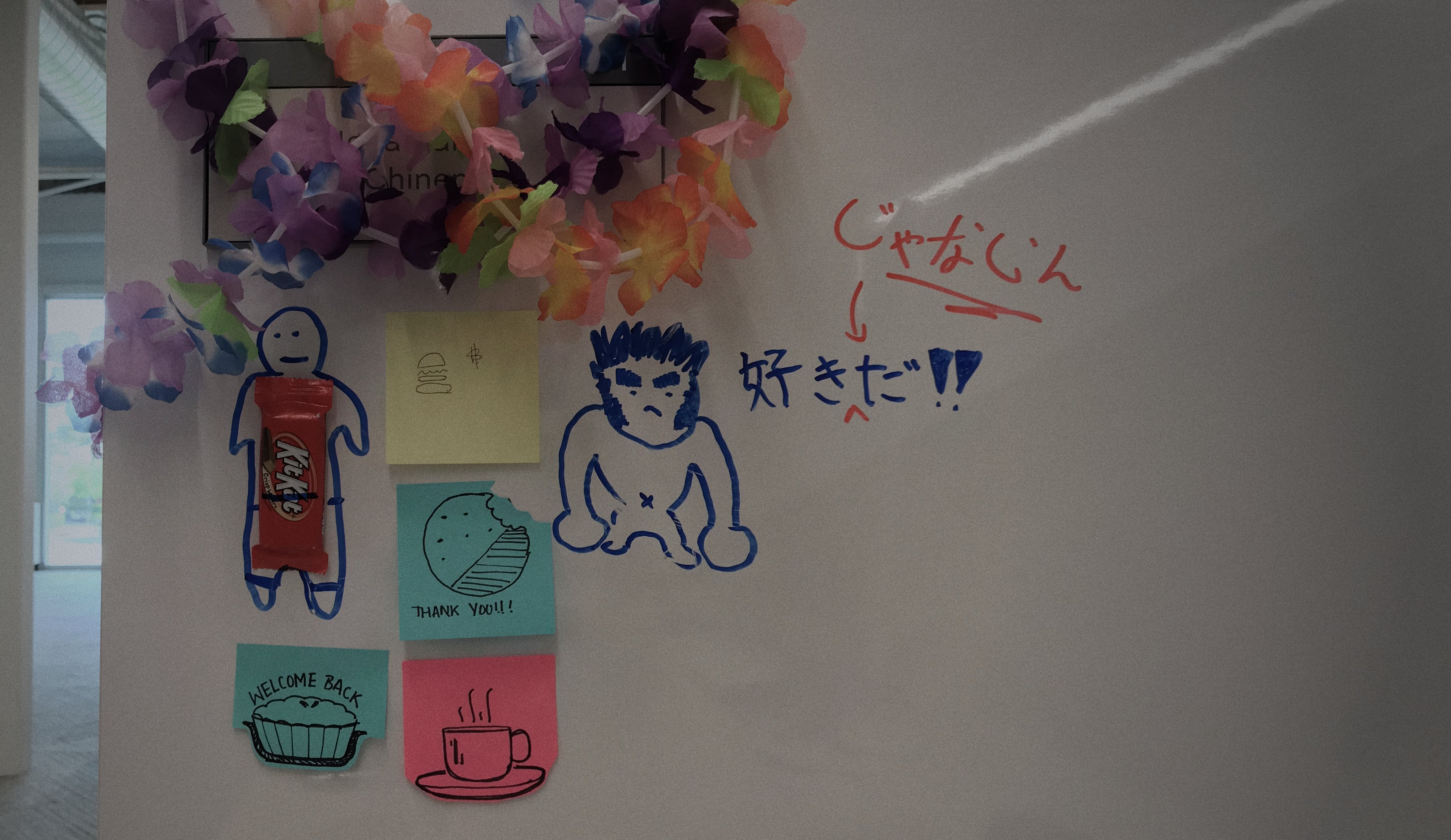 cubicle work space adorned with trinkets and messages of love from friends.